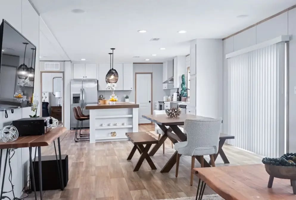 Open Concept Manufactured Home Living Area with hardwood floors  and windows.